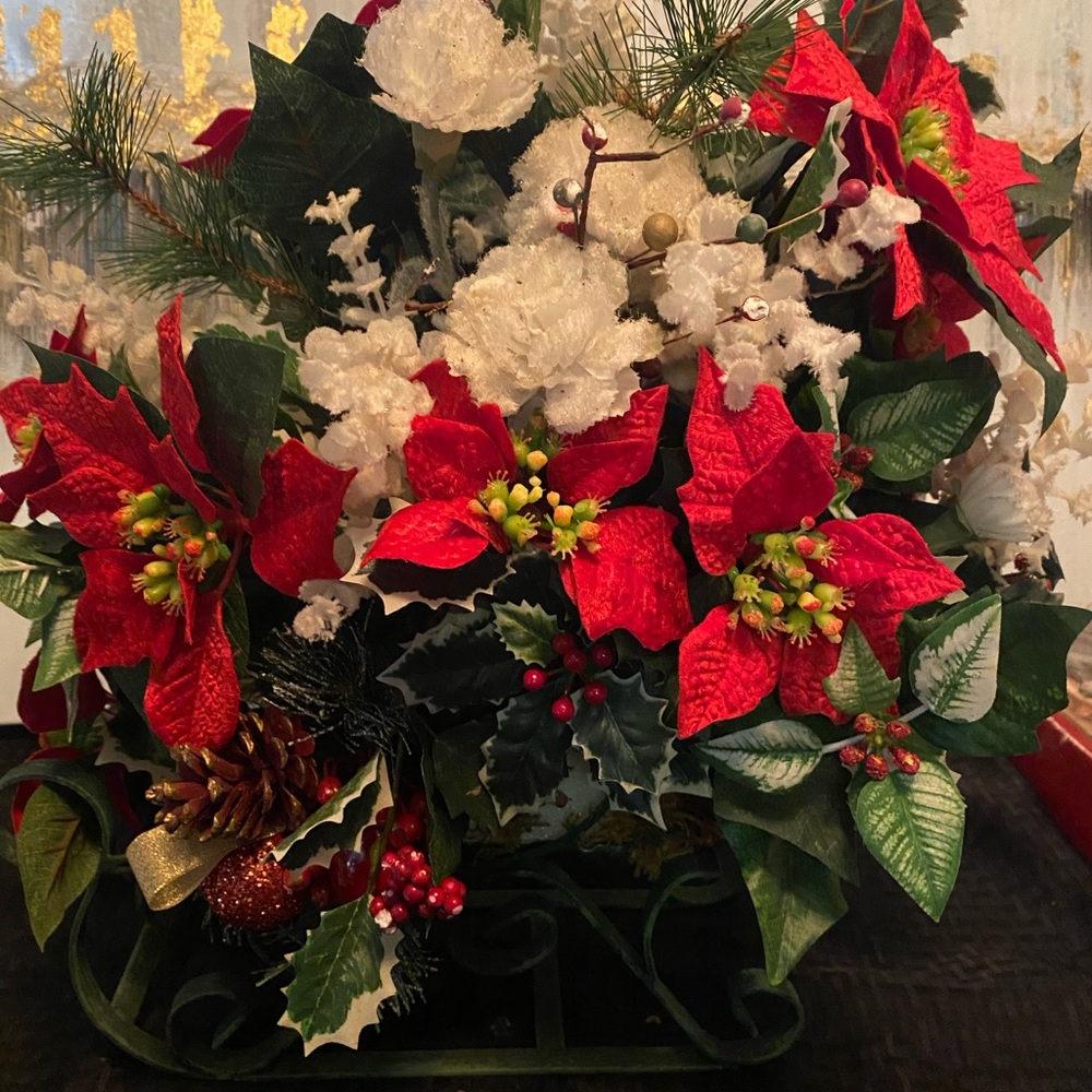 Christmas sleigh with artificial flowers